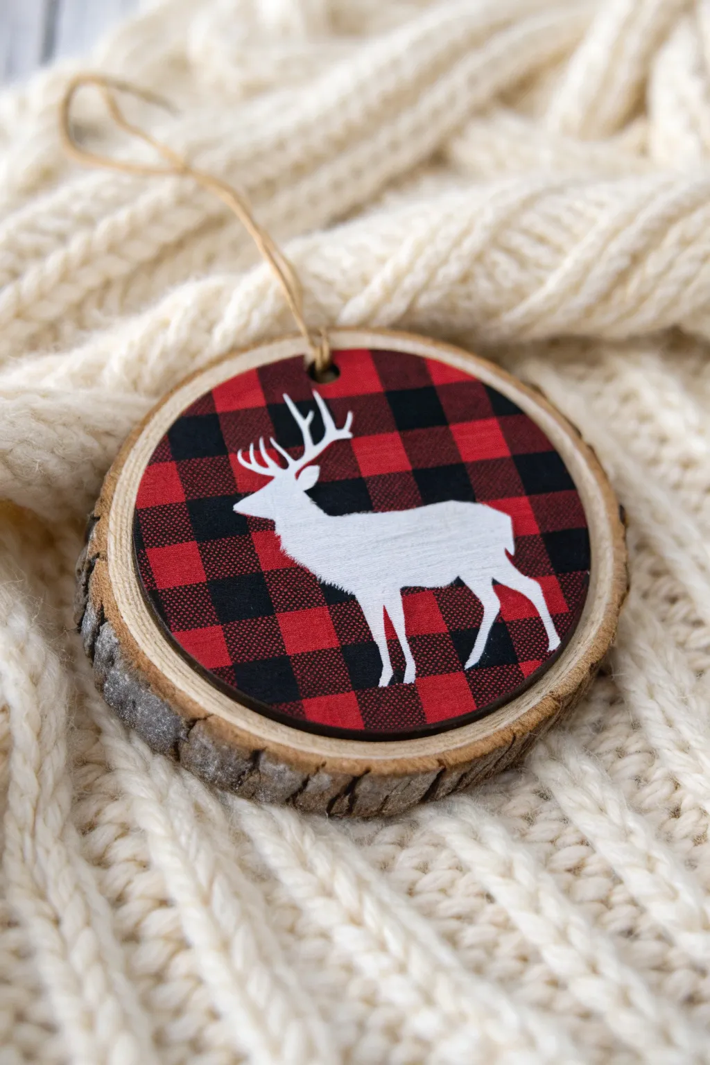 Classic cabin charm: red-and-black buffalo plaid wood slice with a crisp white deer silhouette