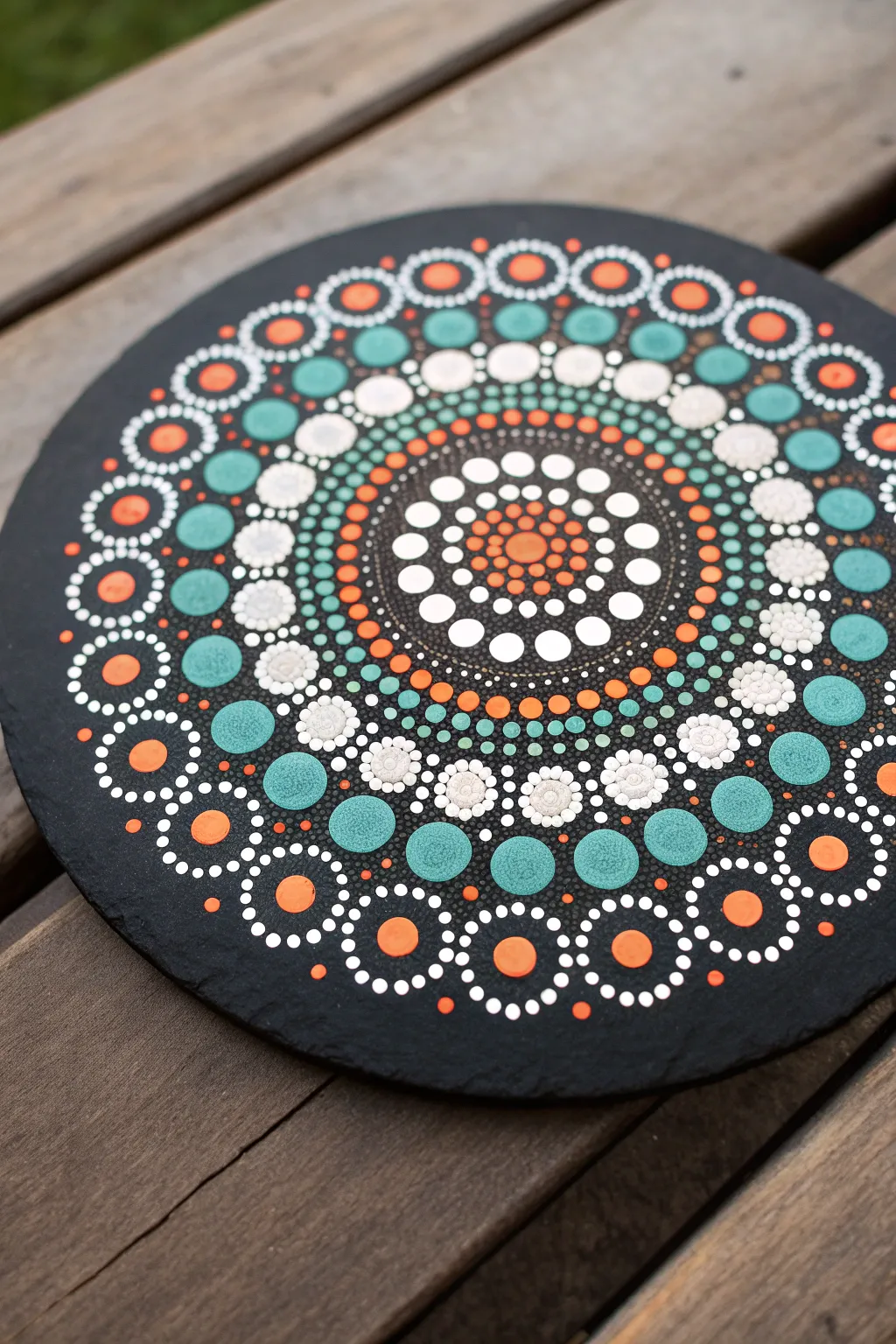 Easy dot mandala on black paper, limited bright palette for crisp, soothing contrast.