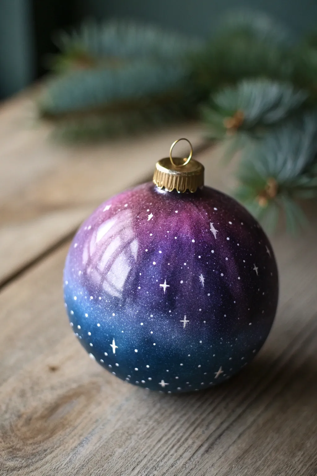 Galaxy ornament in deep blues and purples, dotted with stars and dreamy nebula blends