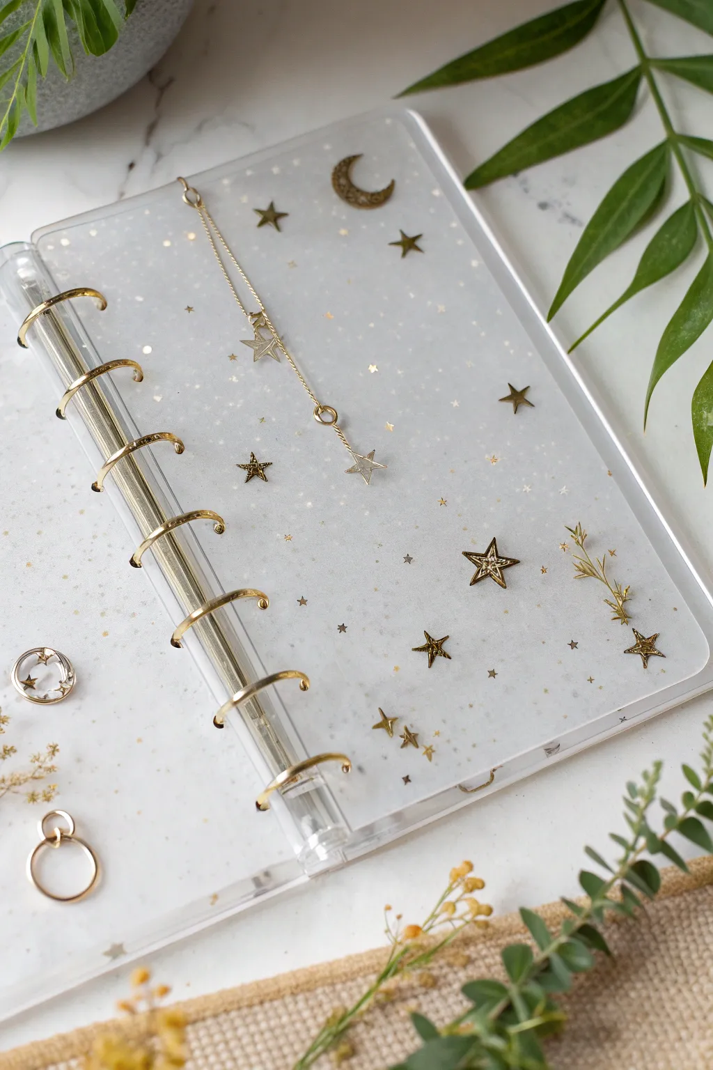 Tiny charm cluster corner in clear resin, minimalist and airy with a soft boho touch.