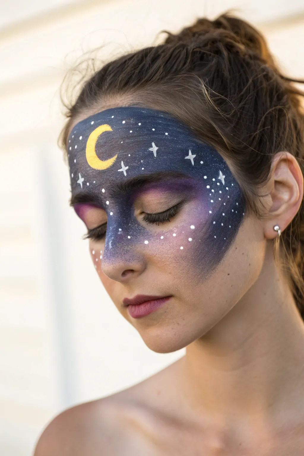 Embrace your inner starlight with this simple and elegant galaxy mask face paint idea.