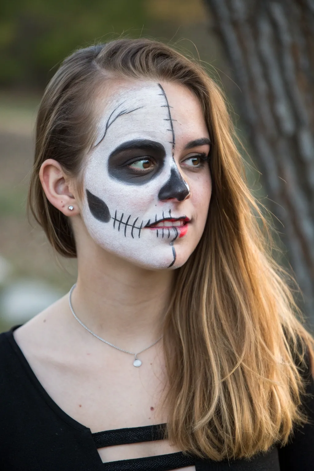 Split-face skull shading vs soft portrait for a bold, elegant transformation moment