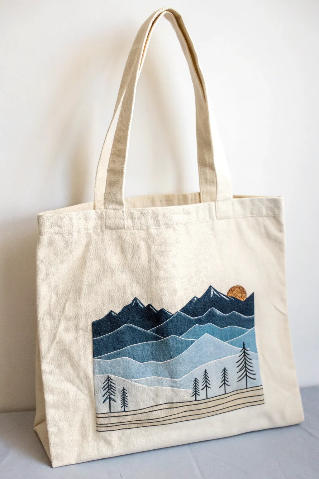 Mini mountain landscape panel on a tote bag for a clean, wearable Scandinavian boho look