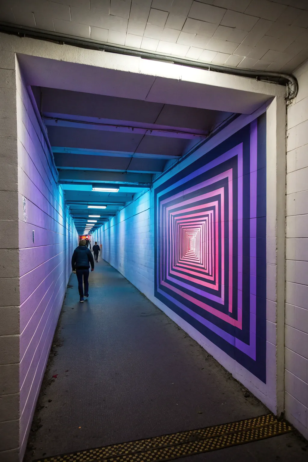 UV tunnel illusion mural: minimalist concentric rings that glow with crisp, modern depth