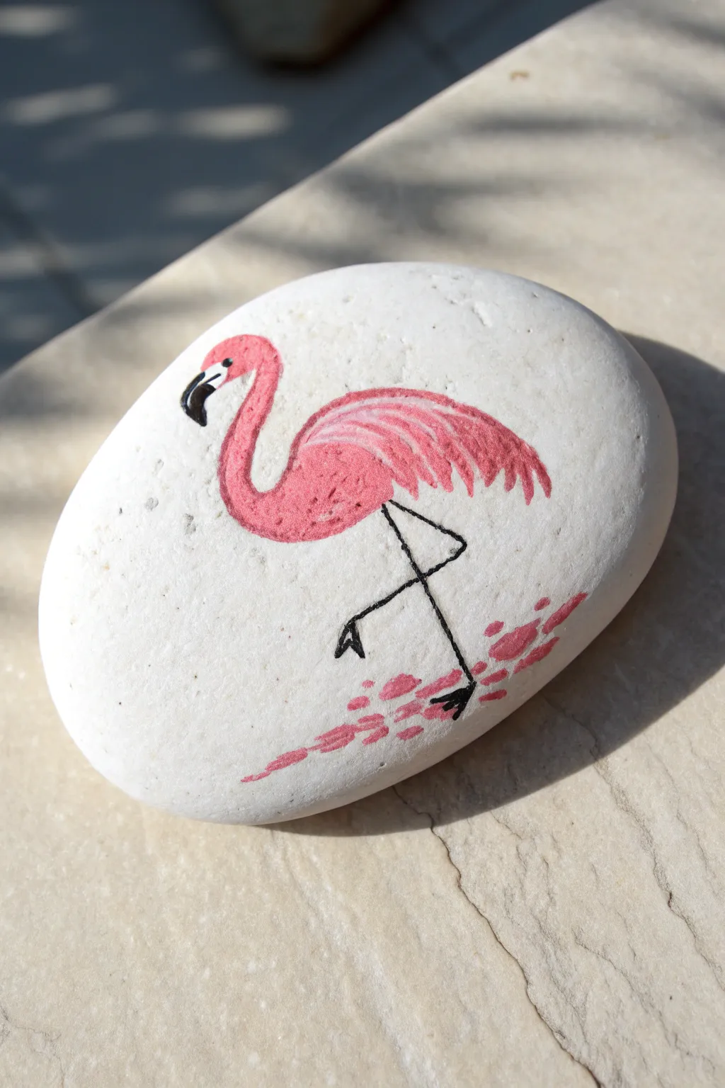 Mini flamingo rock painting: bright pink on a clean white stone, simple and beginner-friendly