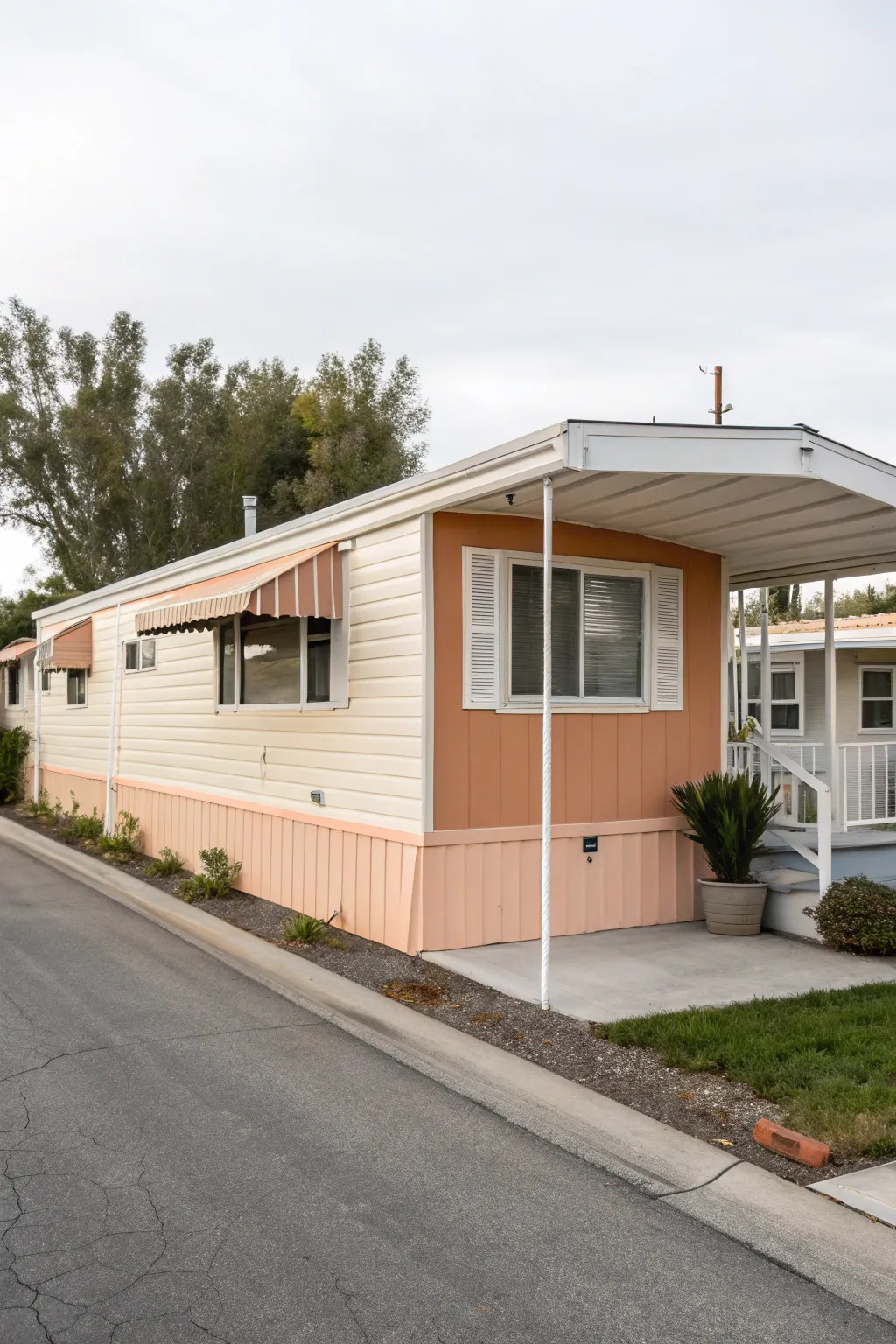 Color-blocked awning turns a simple mobile home side into a cohesive, designer-inspired look.