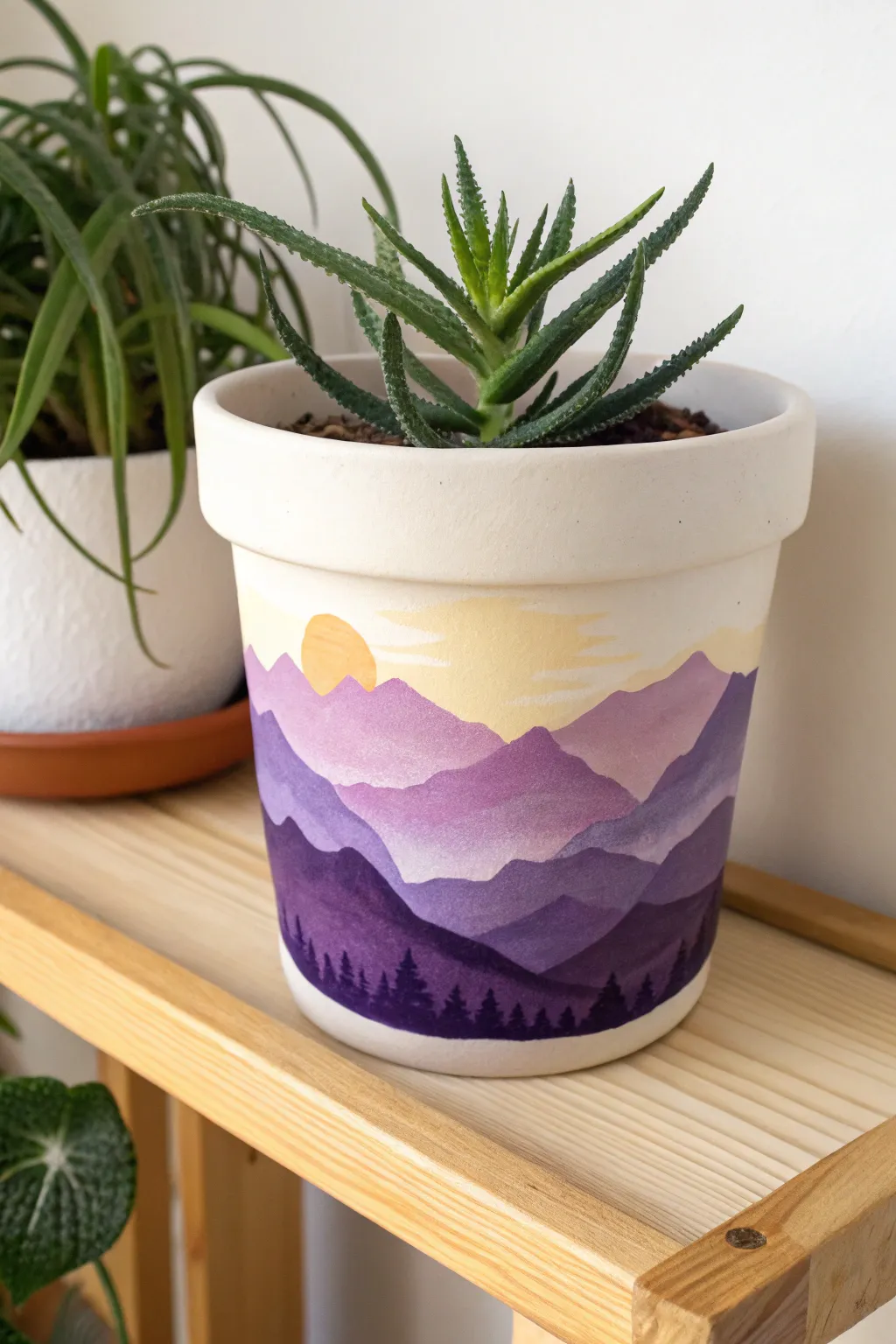 Bring the outdoors in with this dreamy mountain sunset pot design. A perfect boho DIY project!