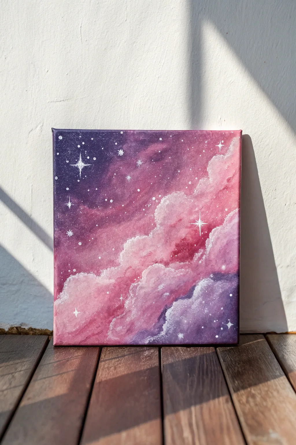 Pink galaxy canvas with soft nebula clouds and star speckles, moody dark edges for depth.