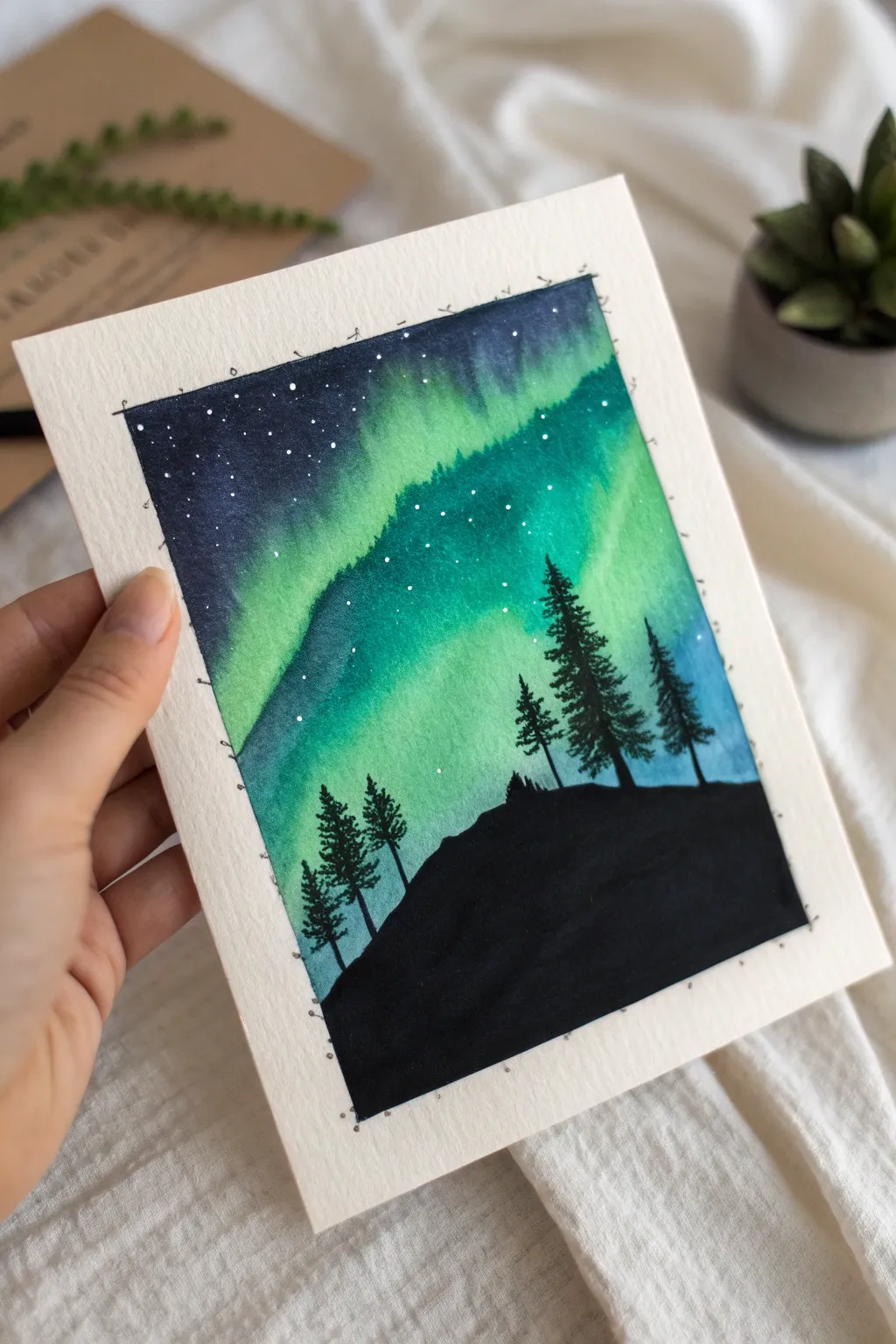 Aurora sky over a crisp black ridge silhouette, minimalist Nordic mood with bold contrast