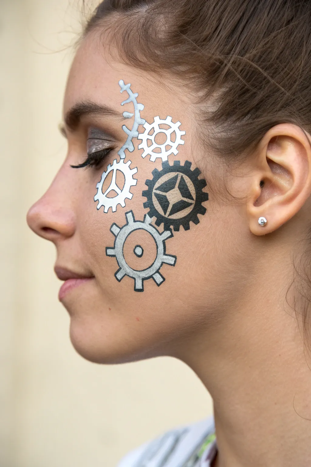 achieve a cool industrial look with these easy metallic robot gear face paint designs