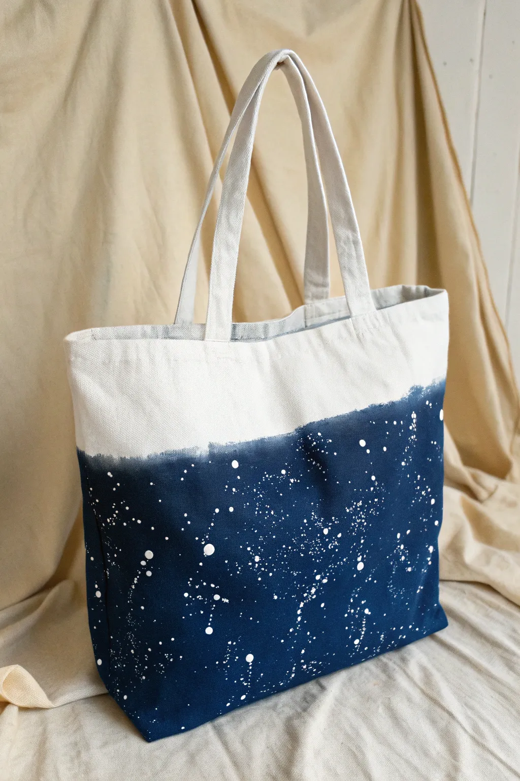 Moody night-sky tote with splatter stars, minimalist setup for an easy paint technique.
