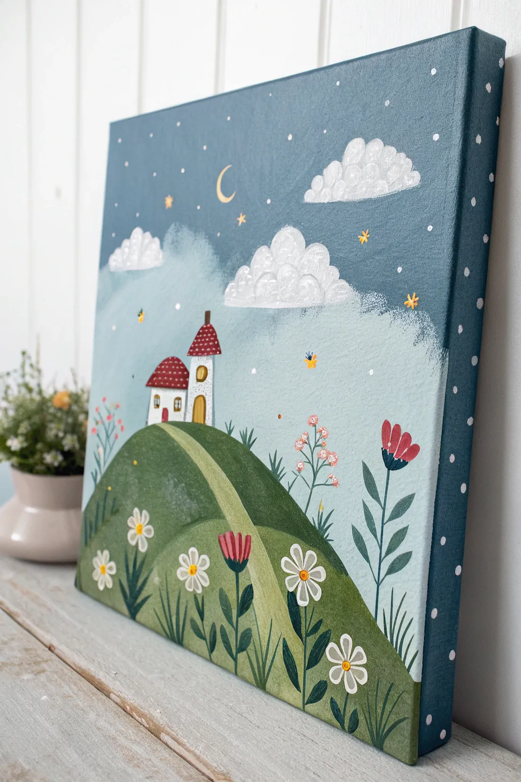 Storybook baby shower guestbook canvas where fingerprints bloom into flowers and fireflies