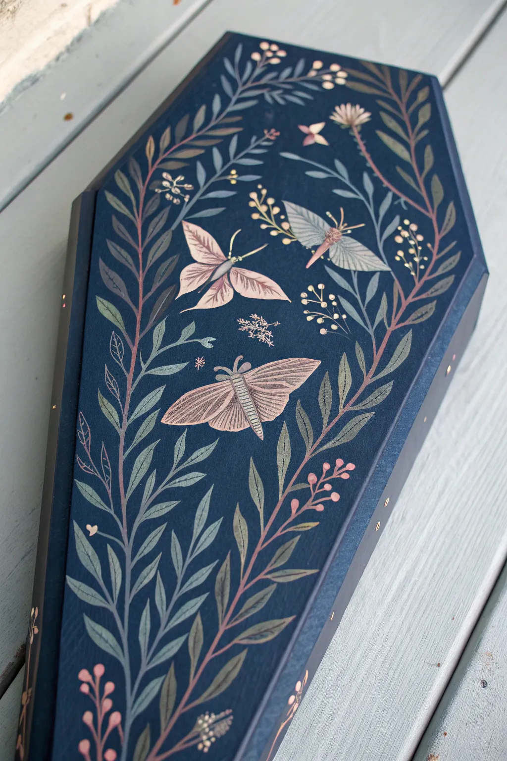 Night garden coffin art: inky botanicals and moths in soft light for moody, feminine vibes