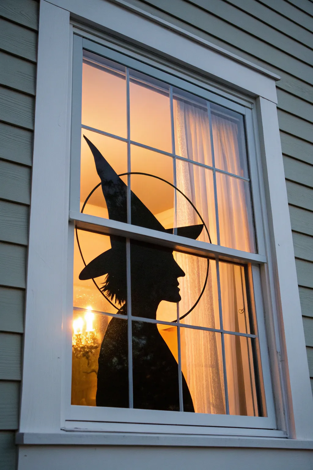 Dusk-lit witch silhouette window painting with a subtle halo glow, minimalist and cozy.