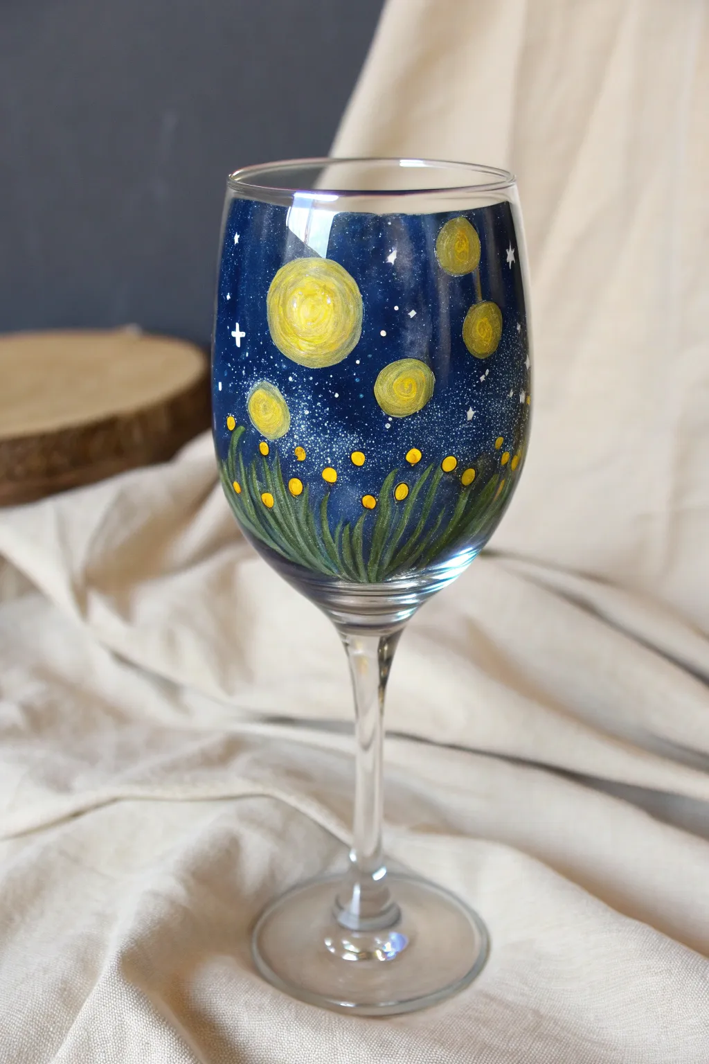 Capture the magic of summer nights with this dreamy hand-painted firefly wine glass.