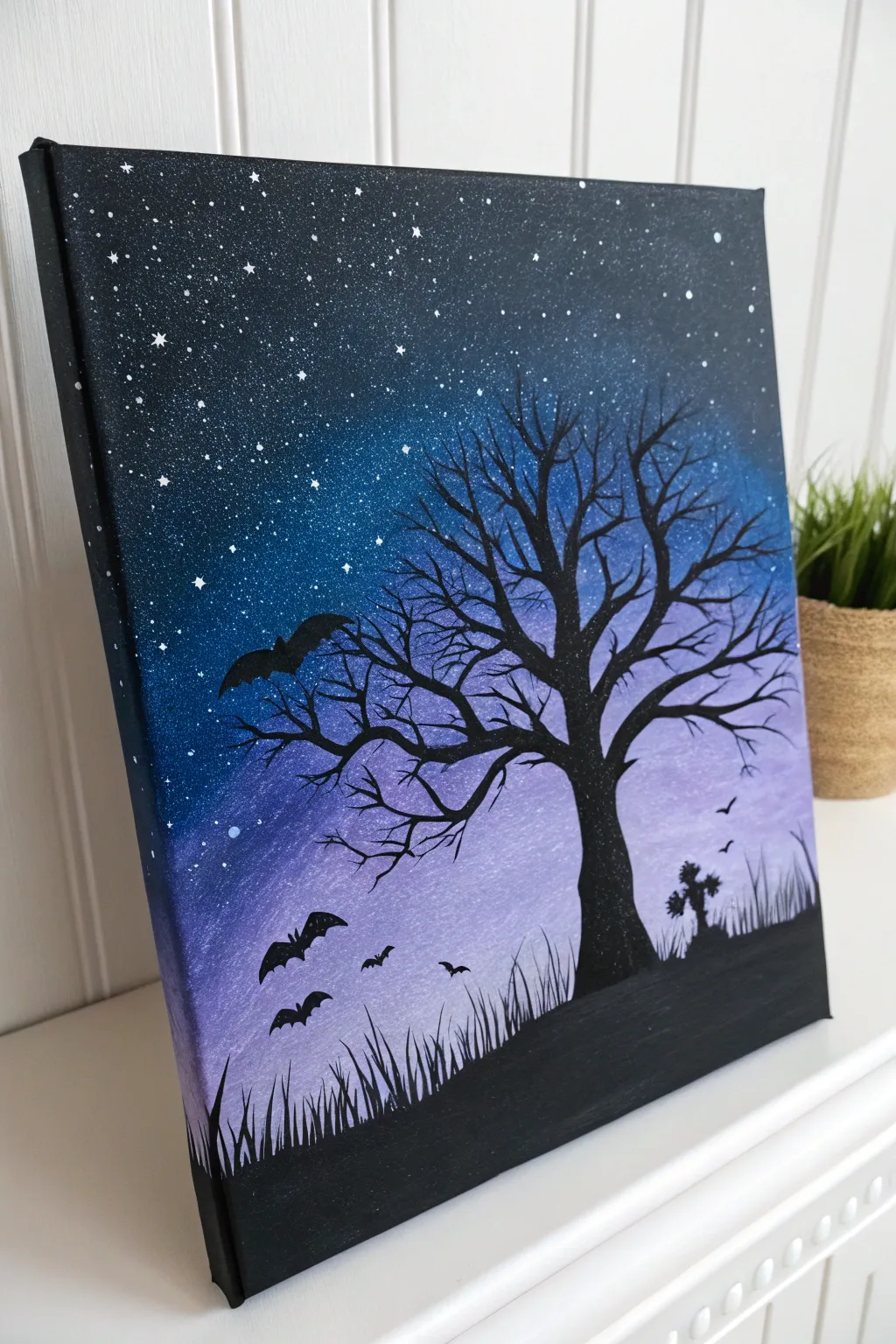 Indigo night sky with glow-dot stars and a bold Halloween silhouette, minimalist and striking