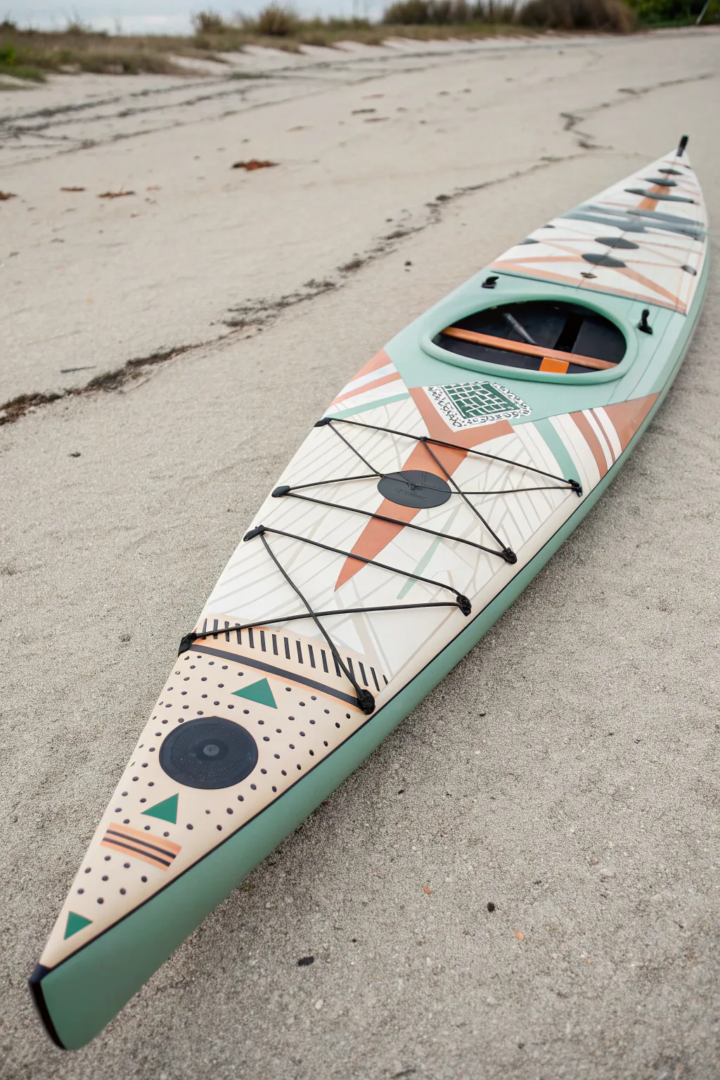 Patchwork panel kayak layout in muted sage and terracotta, simple patterns with calm contrast.