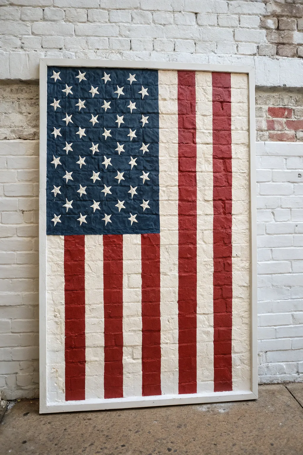 Minimal negative-space flag art in crisp blocks of color for a modern patriotic wall moment.