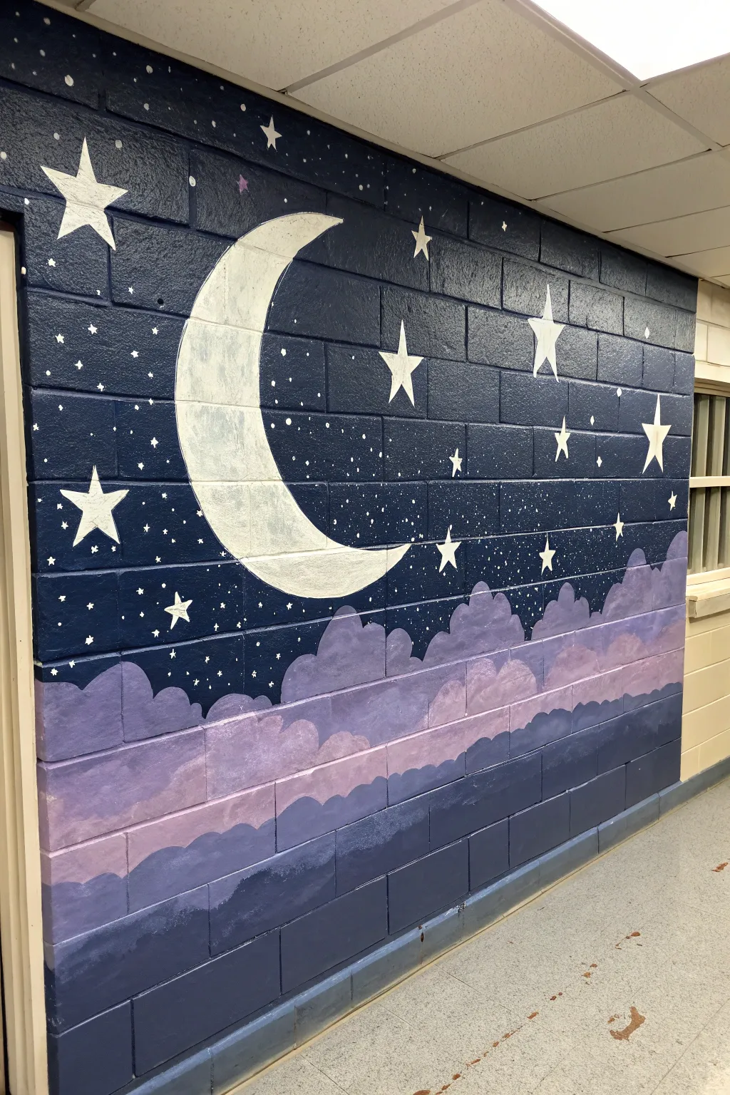 Twilight mural inspiration: deep indigo gradients, soft clouds, and silvery stars for calm sleep vibes.