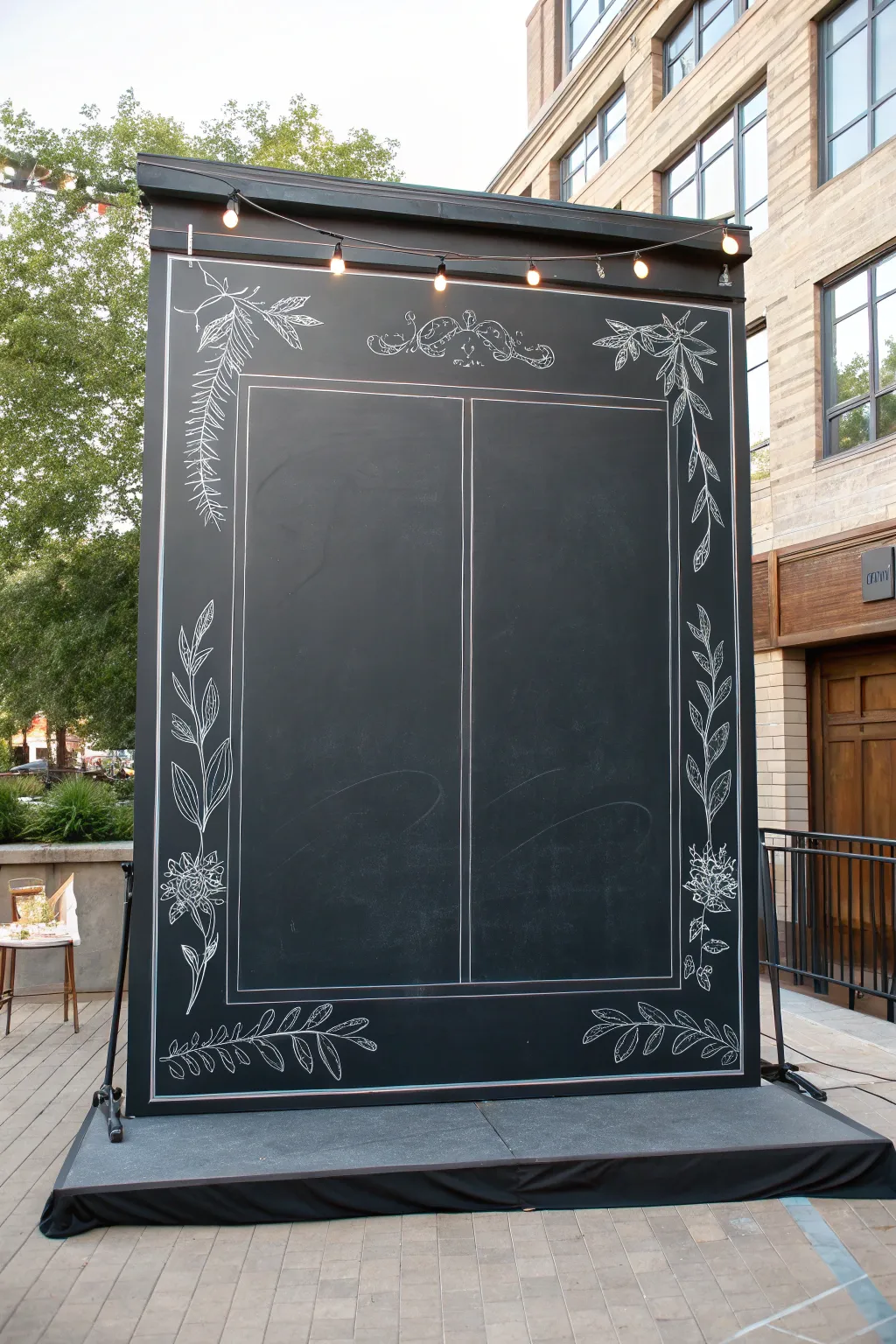 Live-evolving chalk art backdrop: crisp blackboard, botanical frames, and chalk dust mid-process.