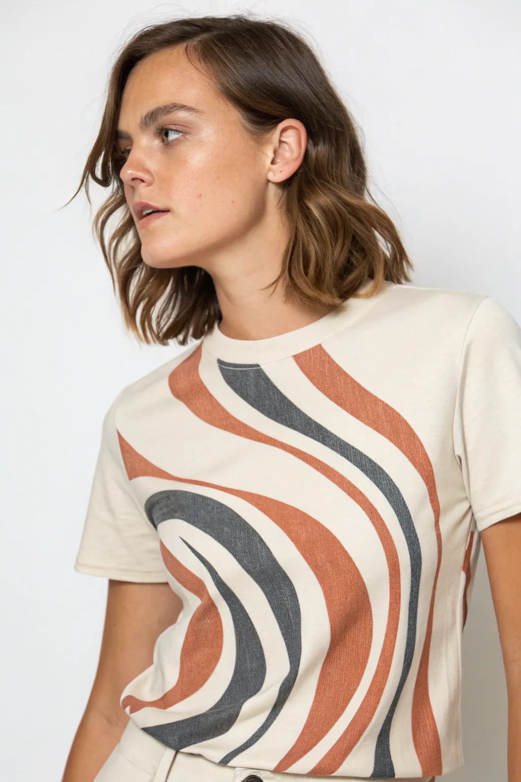 Optical illusion tee art that bends with the body for a bold fold and pinch effect
