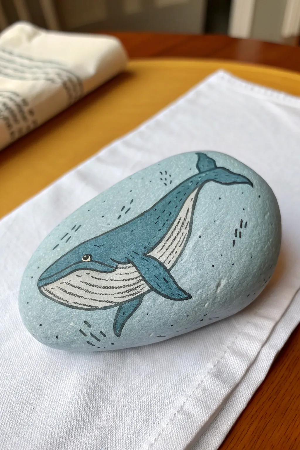 Turn odd bumps into whale anatomy with soft pencil guides and simple, calming paint.