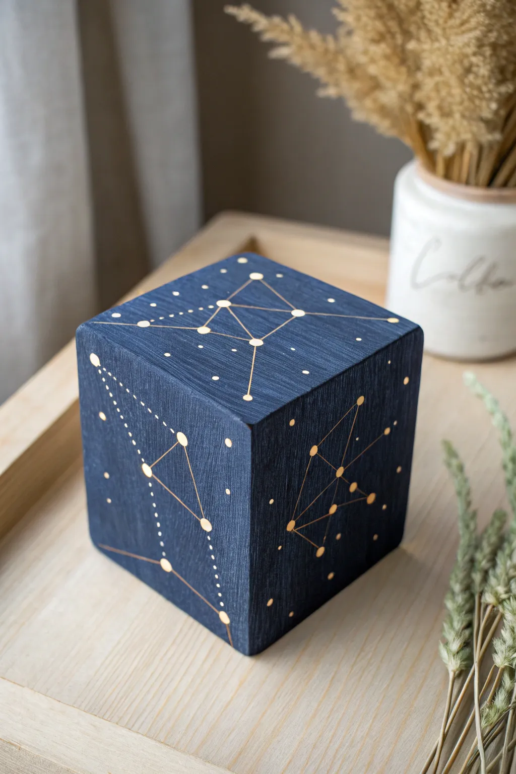 Paint a midnight sky on a wood block and watch the constellations glow softly at night