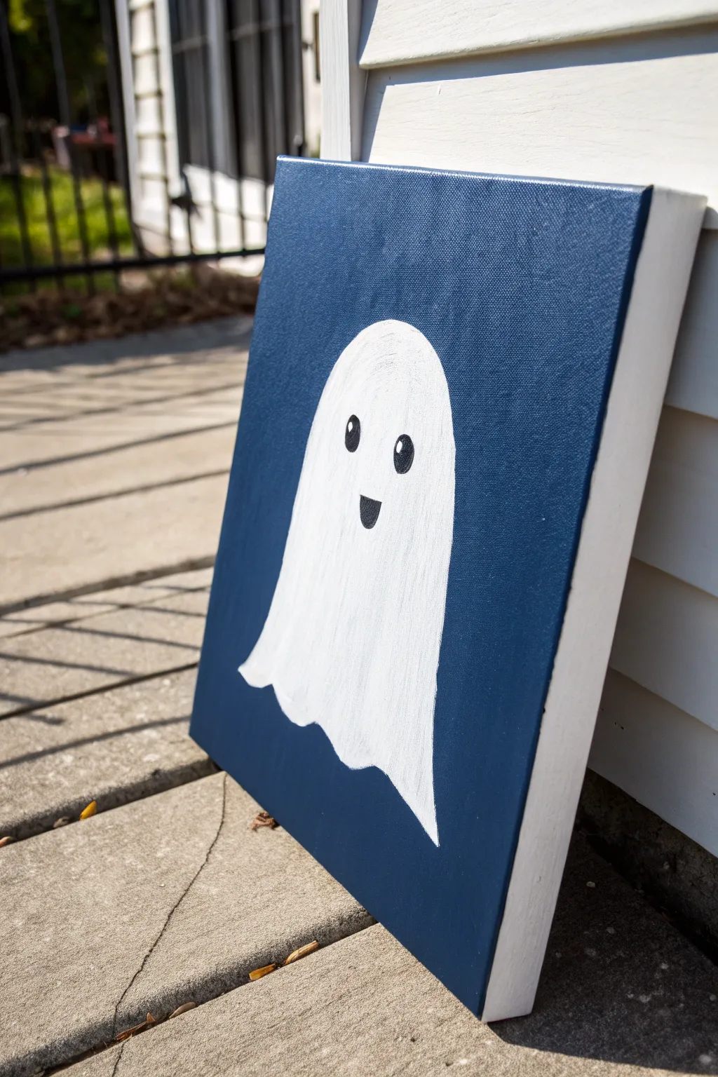 Negative-space ghost floating on a bold midnight blue color field, minimal, cute, and striking.