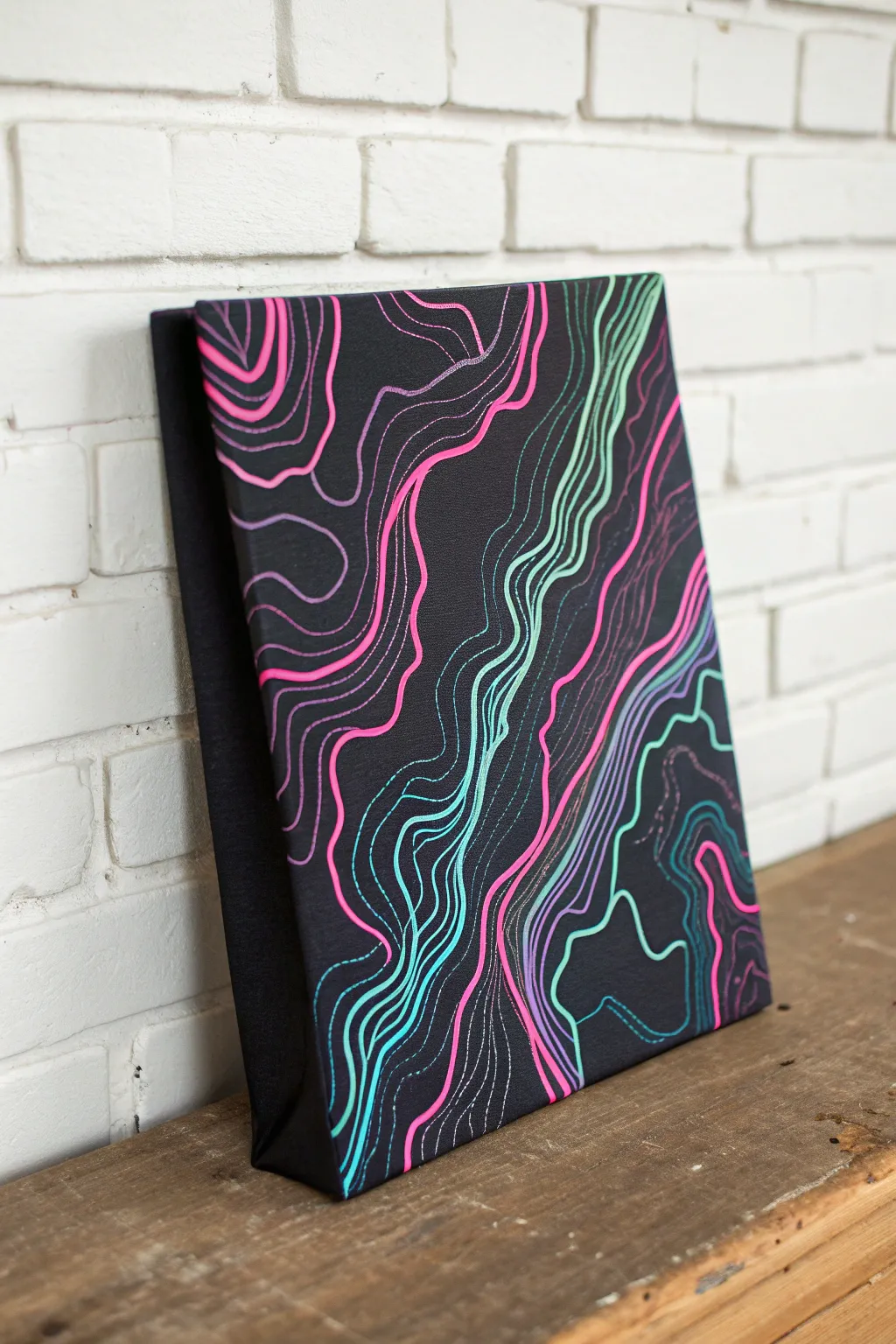 Neon contour lines on matte black canvas, topographic-map vibes with bold minimalist contrast