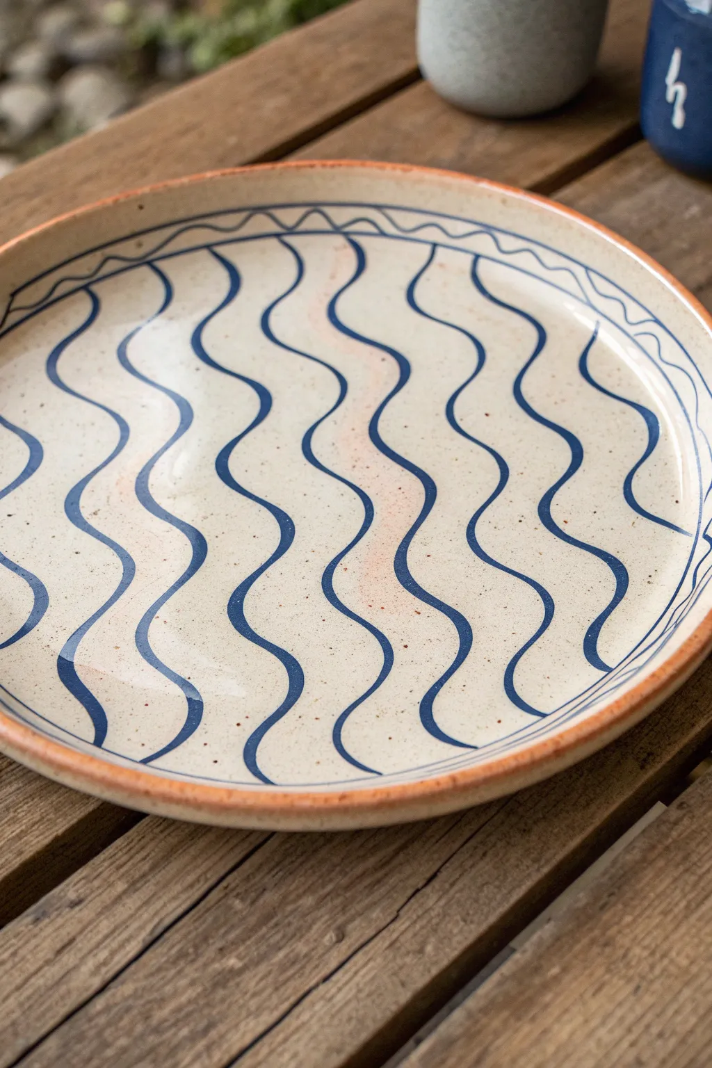 Topographic contour lines turn a simple platter into modern map-inspired art, crisp and bold.