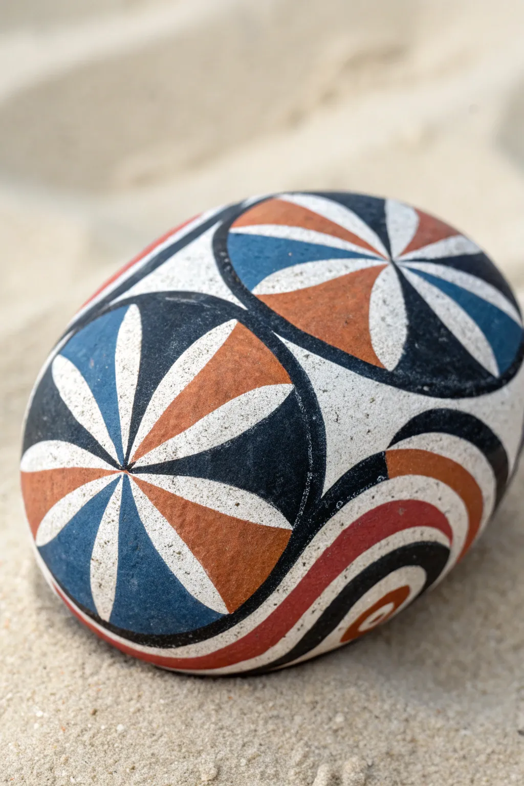 Bold geometric Op-Art stone painting with crisp curves and high-contrast minimalist color