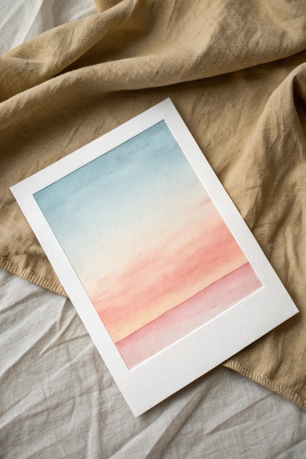 Sunrise pastels made easy: blend peach to pink to blue with a softly blurred horizon line