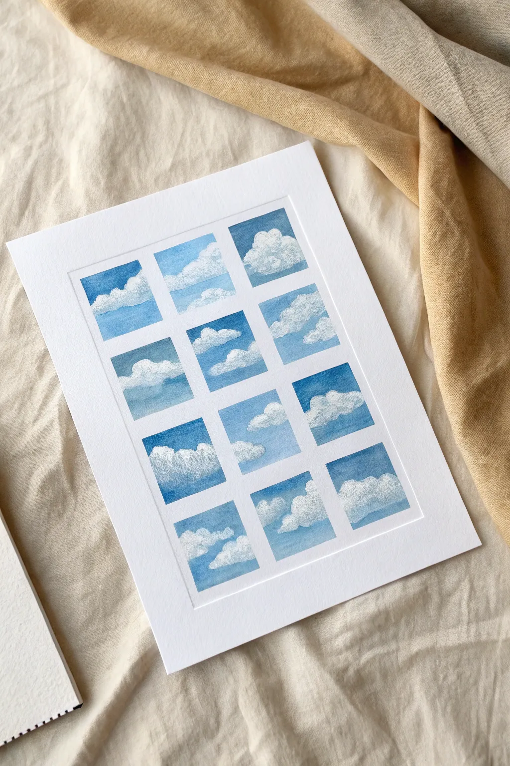 Fluffy cumulus cloud practice sheet: blue sky squares for calm, minimalist watercolor studies