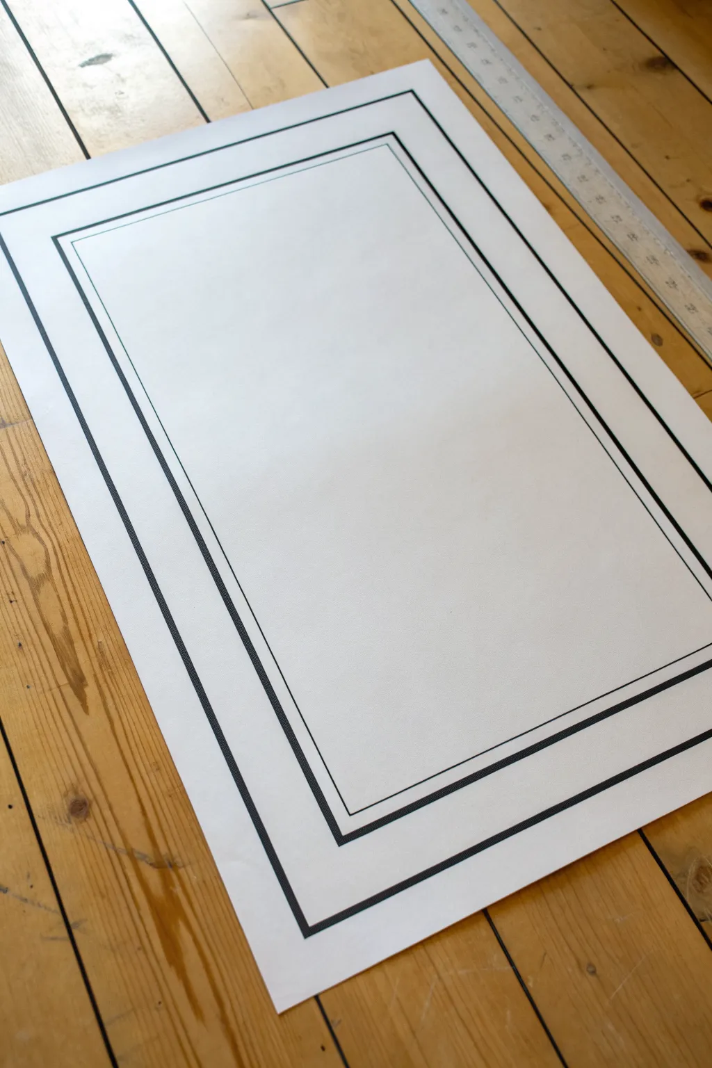 Double-line poster border with wide breathing room and a soft pencil underlayer