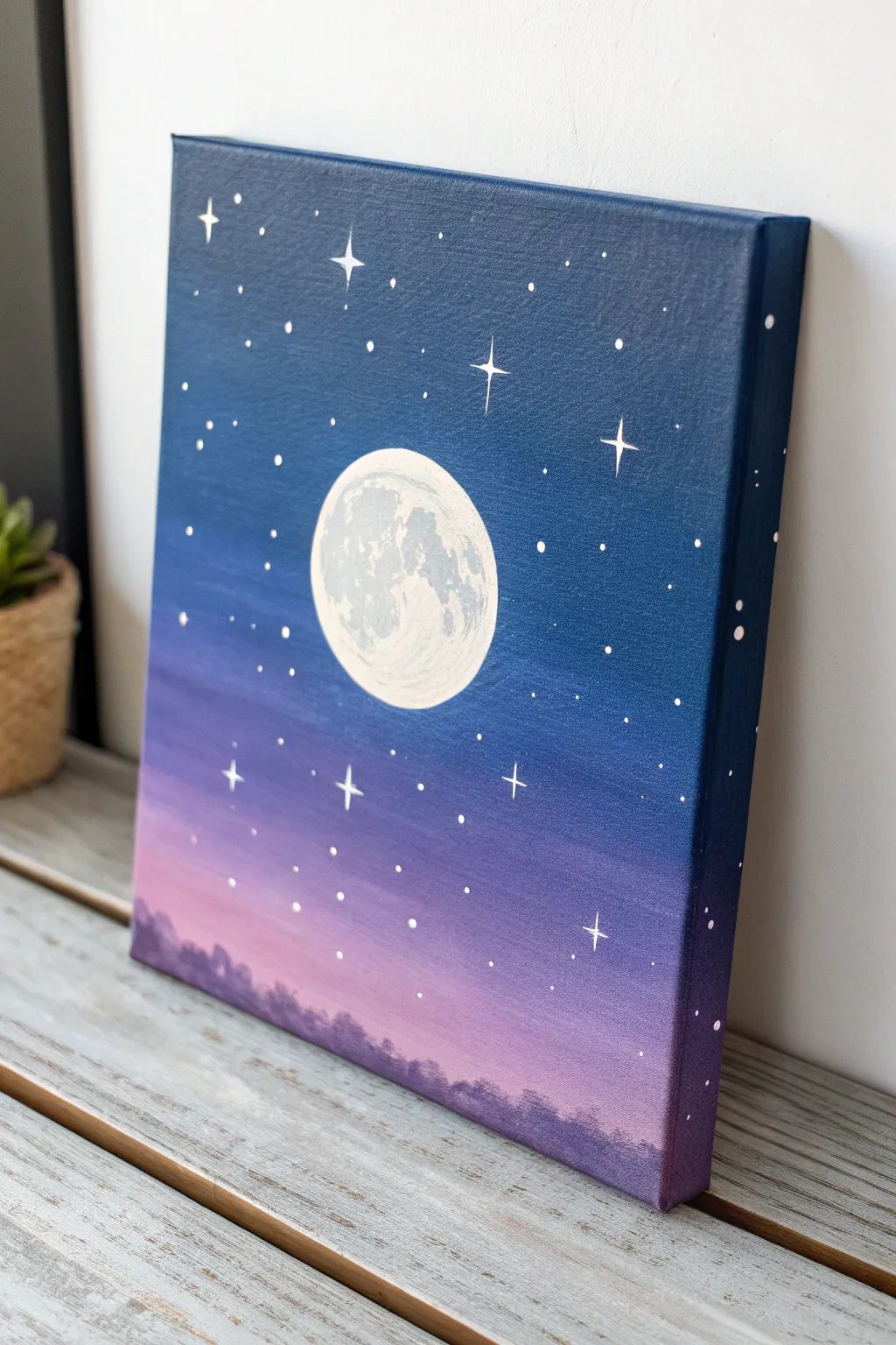 Twilight sky canvas idea: a glowing full moon and simple star dots for an easy kids project