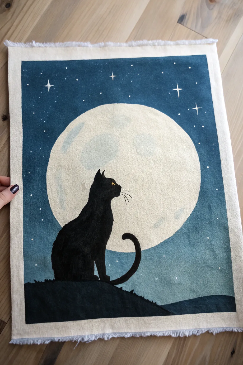 Minimalist black cat silhouette before a full moon, bold contrast in a serene gradient sky