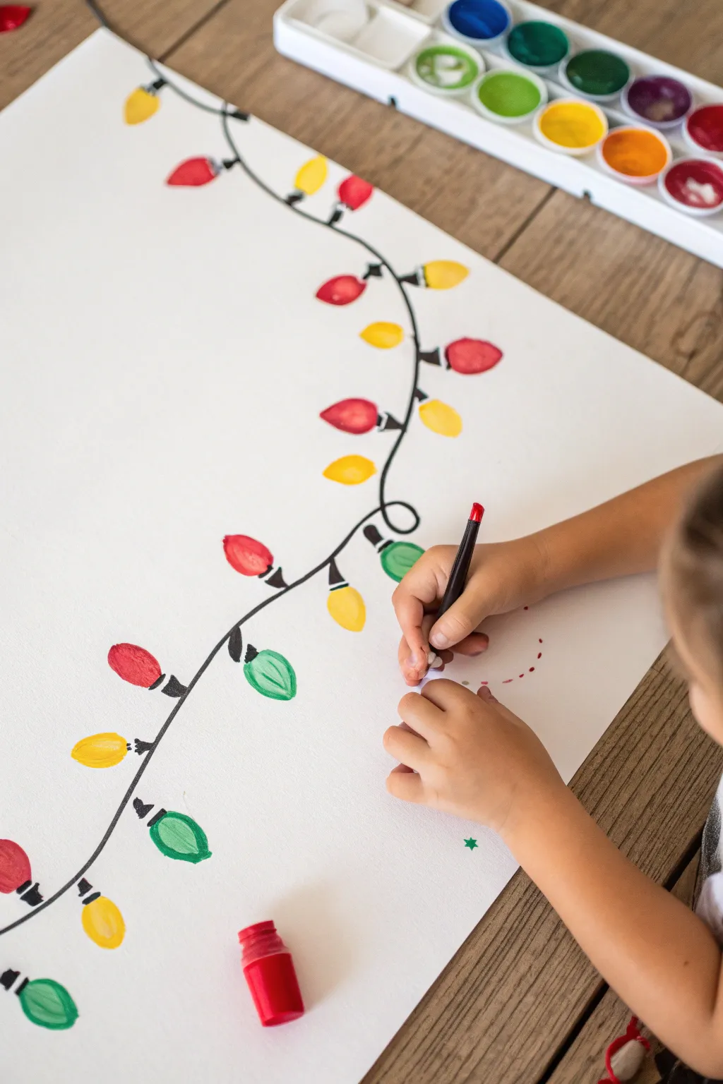 Easy fingerprint Christmas lights garland, a sweet kids craft with bold contrast and festive color