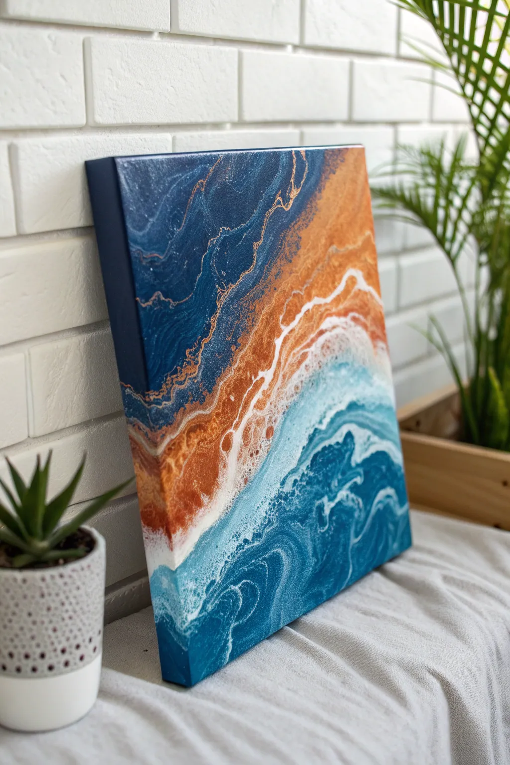 Blue and orange pour palette with crisp white separation and lively cells at the meeting line