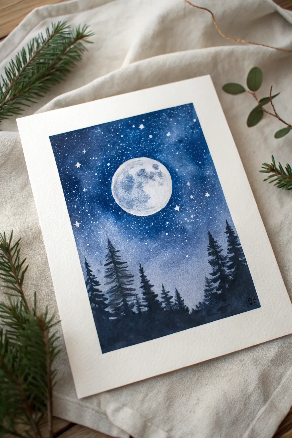 Moonlit pines and a glowing full moon for a minimalist night sky painting idea with crisp contrast