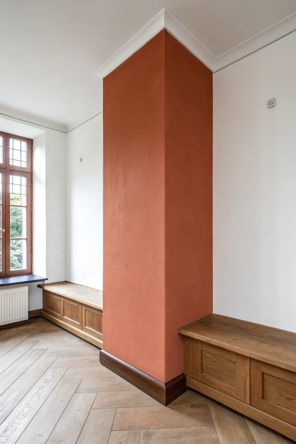 A tall painted corner panel frames the nook, adding high-contrast Scandi-boho warmth.