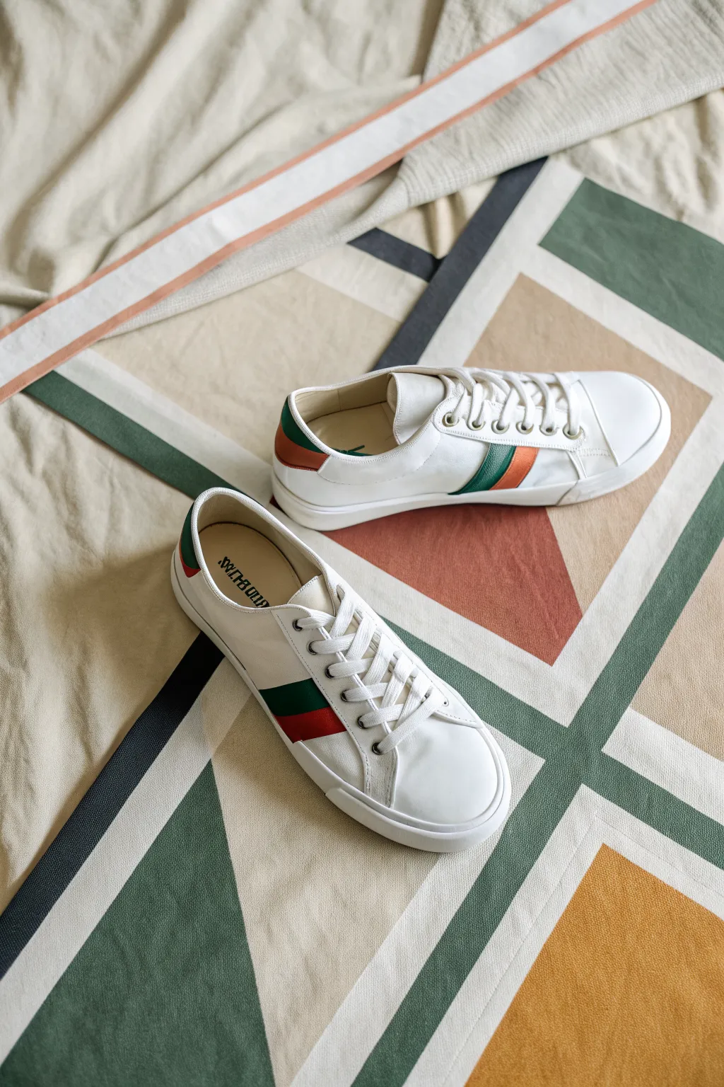 Crisp color-block panels on taped sneakers, paired with acrylic paint for a clean DIY finish