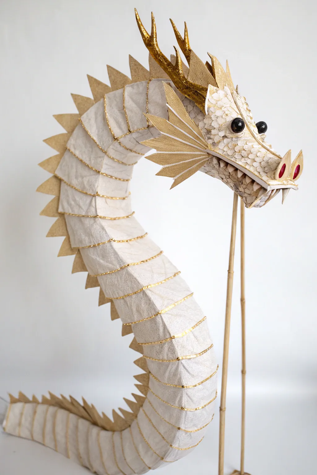 Concertina Chinese-style dragon puppet in an S-swish, minimalist boho craft with bold contrast