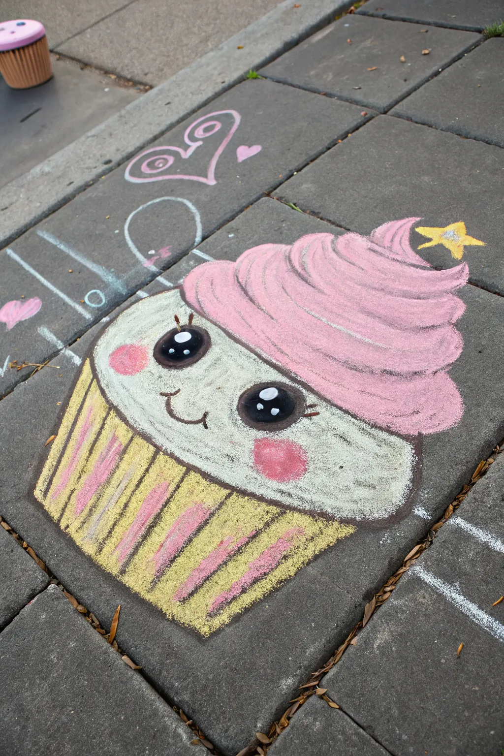 Kawaii cupcake chalk art with sprinkle hair, pastel pops on dark pavement in minimalist Scandi style