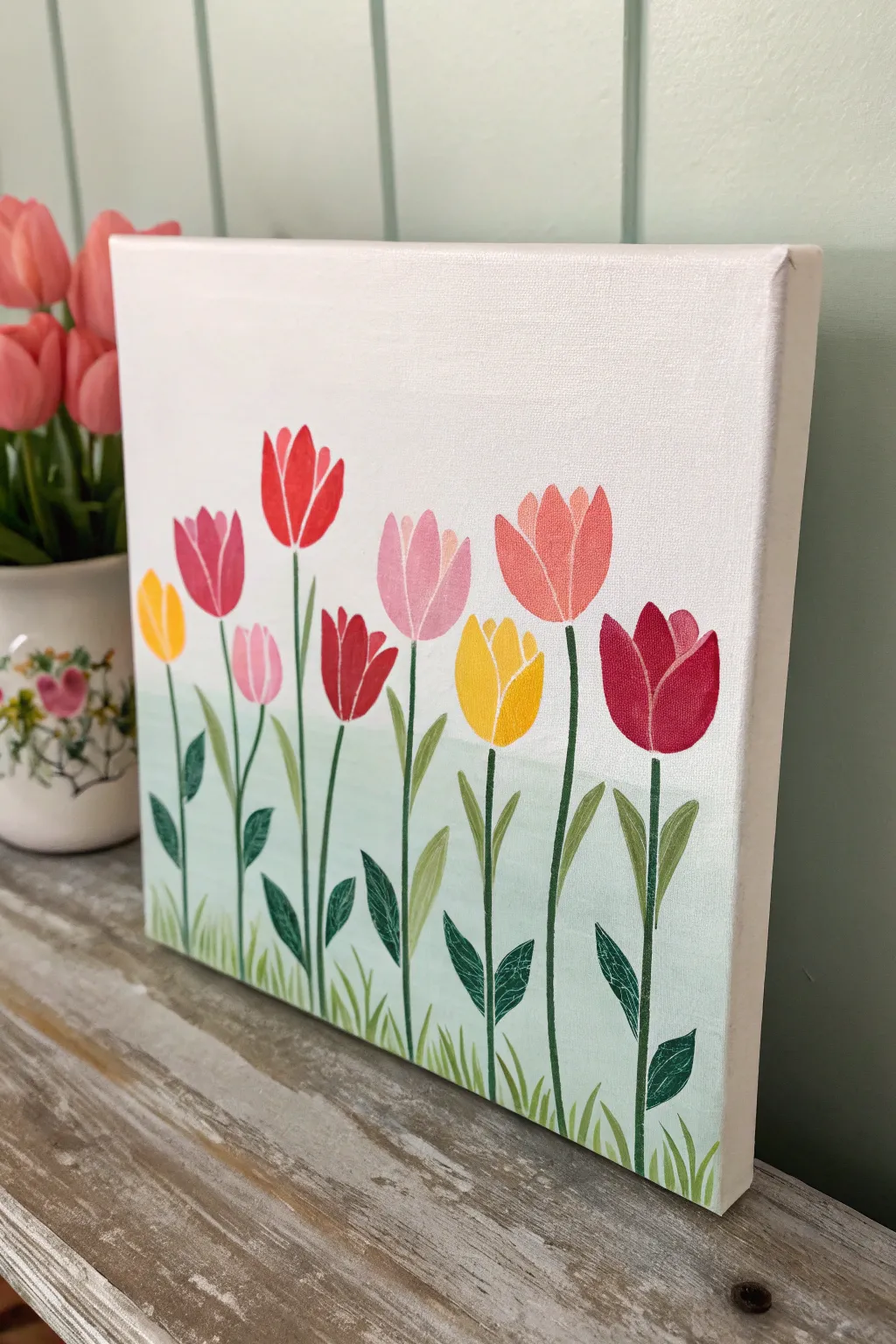 Simple tulip row on a pastel canvas, minimalist spring vibes with bold pops of color.