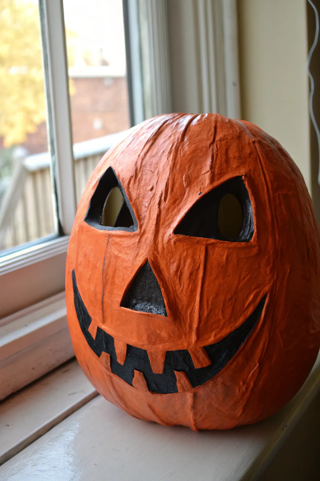 Minimal Jack O Lantern mask in glossy orange with bold black features, perfect for Halloween painting.