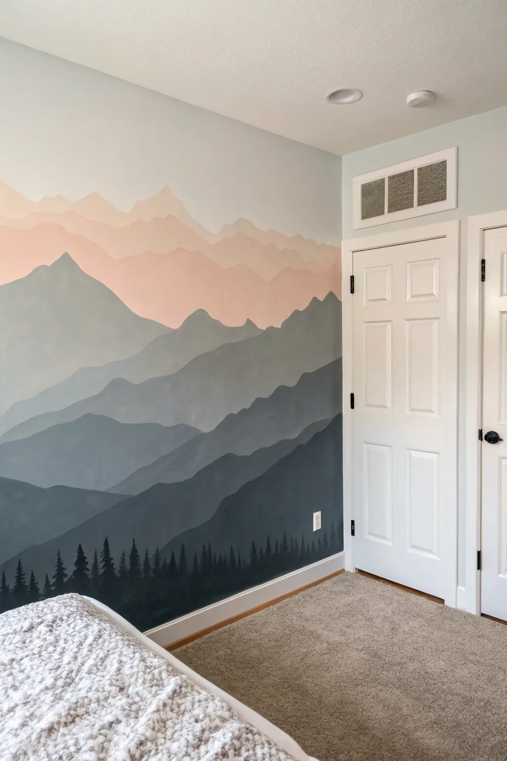 Soft blush-to-charcoal ombre mountain mural, a minimalist hand-painted statement wall.