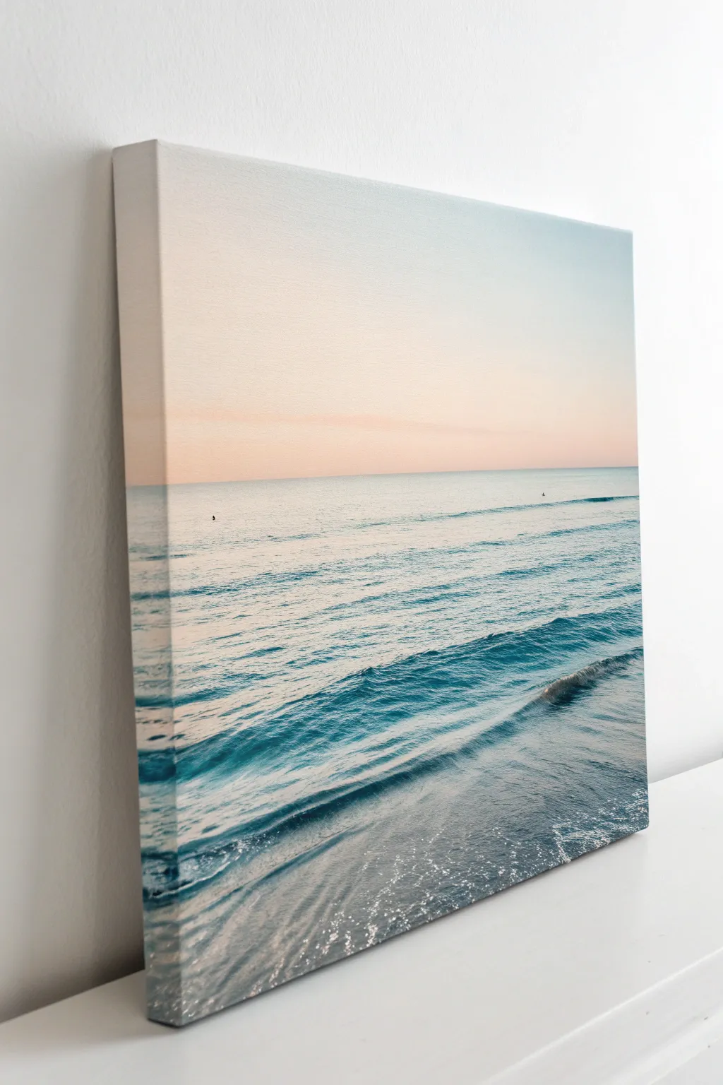 Paint a calm ocean horizon with layered blue bands and a soft light reflection.