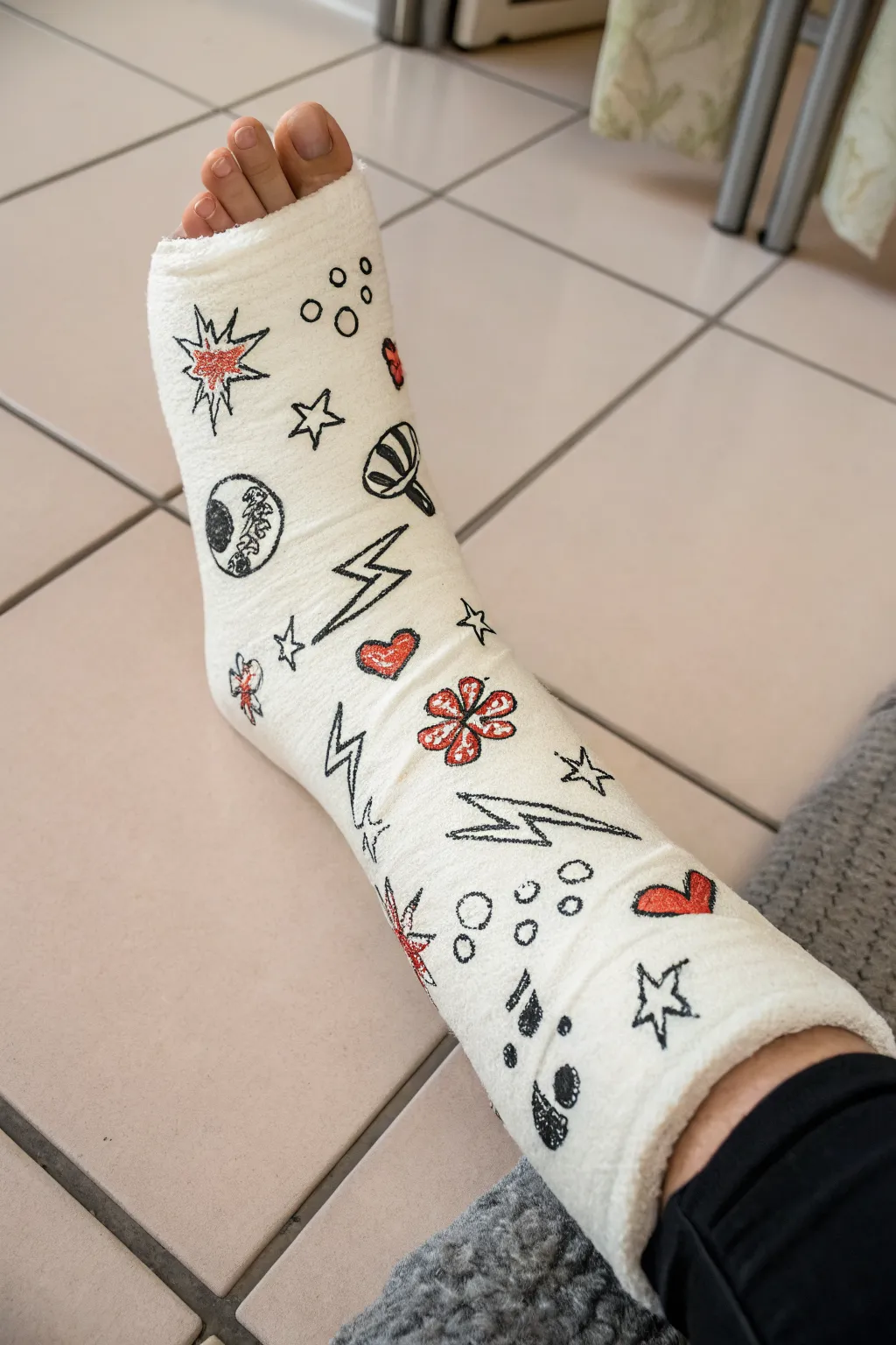 Bold chunky doodles scattered across a clean white leg cast for playful, minimal decor inspiration.