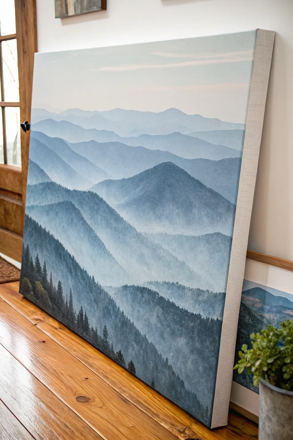 Paint misty mountain layers on a medium canvas using soft gray blues and one bold ridge.