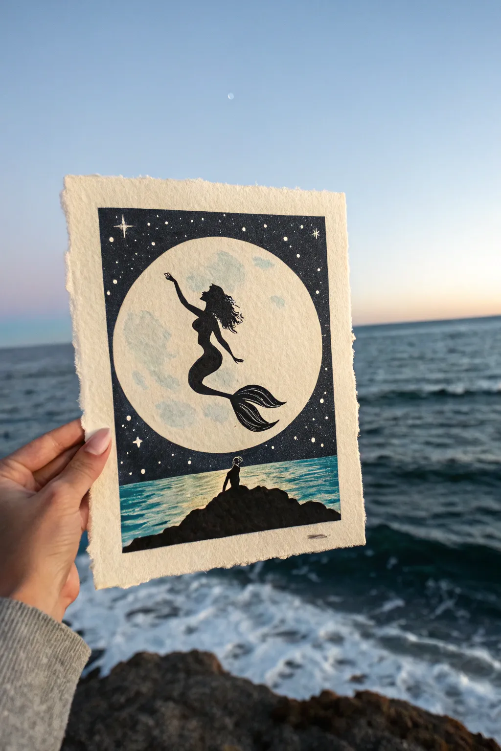 Moonlit mermaid silhouette with glowing full moon and shimmering sea reflection in minimalist style